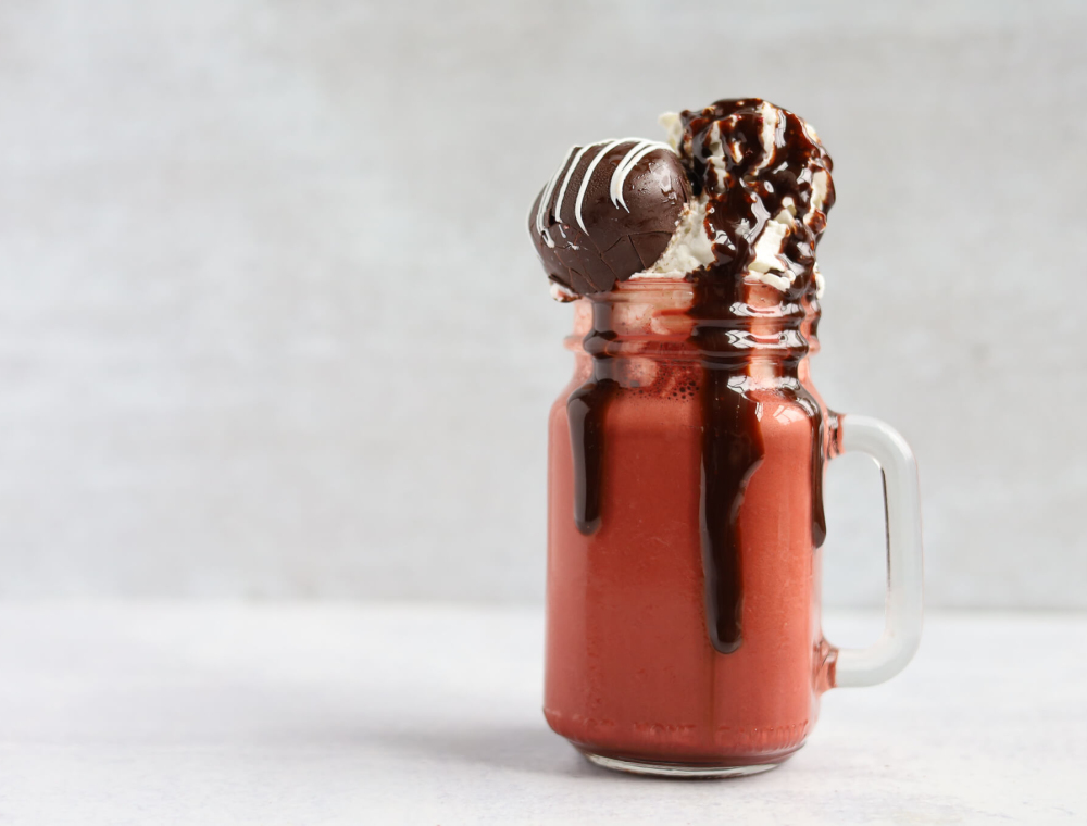 This #BWCboozyshake is made with Baileys Irish Cream, New Amsterdam vodka, red velvet cookies and cream gelato, whipped cream and garnished with a red velvet cake ball. It’s love at first sip!